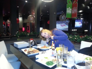 Dani with a variety of yummies at Dave & Buster's